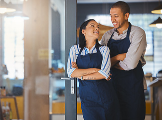 Image showing Small business owner, startup couple standing in coffee shop, cafe or store happy with business dream or entrepreneur development. Manager CEO man and woman with a vision, confidence and success