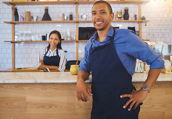 Image showing Small business owner or startup entrepreneur standing at a bar counter in a coffee shop or cafe as a team leader. Motivation, vision and teamwork with young people working in retail restaurant