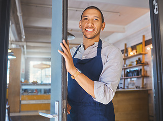 Image showing Opening store, entrance door and welcome to cafe, coffee shop or small business. Happy male manager, proud store entrepreneur and hospitality worker ready for success and service in an open startup