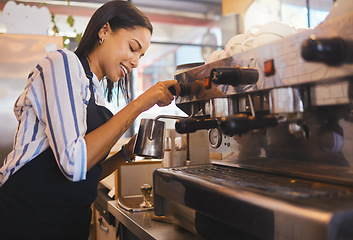 Image showing Coffee shop, cafe and restaurant with a barista working as a startup entrepreneur and small business owner. Waitress or server giving service with a smile while at work in a modern and trendy bistro