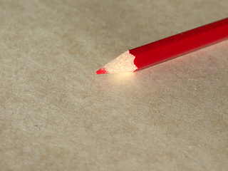 Image showing Red pencil over paper