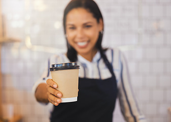 Image showing Coffee shop, closeup and barista holding cup and giving it to the customer at cafe. Female restaurant service worker in beverage business. Small business, management and food worker serving client.