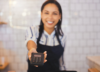 Image showing Payment, card reader and money with a friendly coffee shop employee or cafe worker holding a scanner to service an order. Tap to pay, nfc and simple technology to purchase, buy or make a purchase