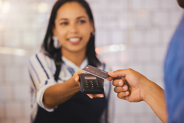 Image showing Credit card, payment and customer with an electronic reader in the hand of a cashier to process a fintech purchase or money spend. Consumer making a banking or finance transaction in a coffee shop