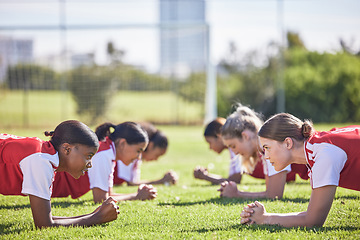 Image showing Football, soccer and plank exercise drill of girls training team working on a fitness workout. Focus, motivation and teamwork collaboration of sports group of students on a school sport grass field