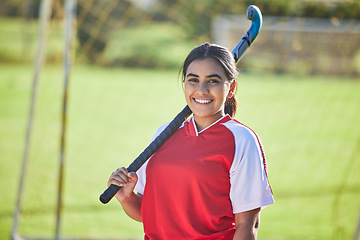 Image showing Happy female hockey coach portrait, womens team sport player with natural field background outdoors alone. Confident athlete training for competition, motivation fitness and collaboration exercise.