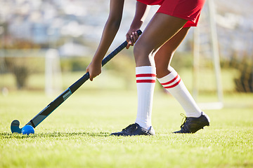 Image showing Hockey practice or game workout or sports training with a player exercise fitness for a match or sport field event. Strong athlete being active, healthy and fit running outside with ball with a stick