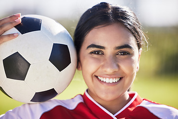 Image showing Training, football and portrait of a sporty woman face and soccer ball, enjoying sport and a healthy lifestyle at a field or park. Happy player having fun with fitness, being active and carefree
