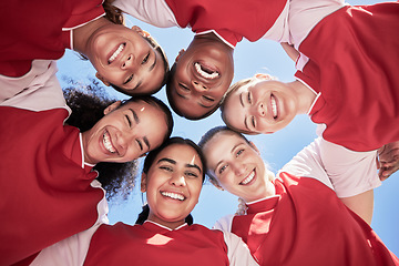 Image showing Female soccer team in a huddle smiling in unity and support in a circle. Below portrait of an active and diverse group of women football players or athletes happy and excited for a sports match