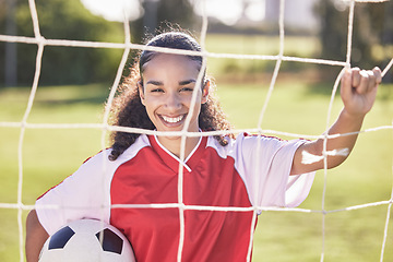 Image showing Happy, motivation and woman soccer player with a football ready for a workout, match or exercise. Portrait of a teen student girl in a sport uniform before fitness and school sports training field