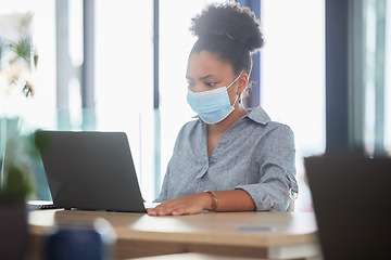 Image showing Covid, face mask and a black woman working on a laptop in a modern office. Sick businesswoman on the internet at work. College student, online exam and in campus library, protected against the virus.