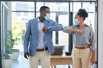 Image showing Covid regulations, elbow bump greeting and social distance in office with mask. Company work during lockdown, young startup manager interviewing new joiner and recruitment for growing team.