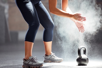 Image showing Fit, dust, kettle bell of female in fitness clapping hands of chalk in the gym. Healthy, wellness and athletic woman preparing for training exercise or workout, motivation and sports.