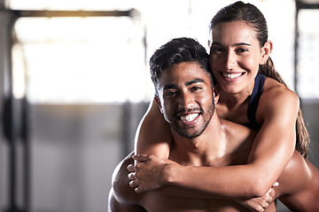 Image showing Fitness couple, gym friends and team hugging, holding and celebrating successful workout, training and exercise together. Portrait of smiling, happy and healthy man and woman after wellness teamwork