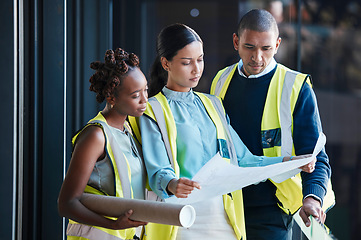 Image showing Construction, architect plans and diverse engineers consulting and planning a design as a team. Group of creative, professional and successful industry workers analyzing architecture documents.