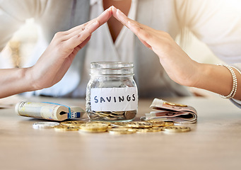 Image showing Savings, investment and insurance cover business woman with coins, money and cash in a jar for future plan or personal growth development or housing. Closeup hands covering bank or mortgage expenses