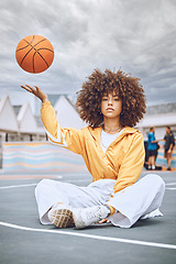 Image showing Sitting, serious basketball player and fitness sports woman after a health, wellness and motivation workout portrait. Girl on a court, throwing a ball up and relax after game, training or exercise