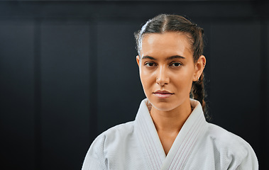 Image showing Karate, martial arts or taekwondo woman, coach or trainer with vision, motivation or power in wellness gym. Fitness portrait of serious or fit sport fighter after health workout, exercise or training