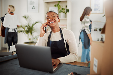 Image showing Small business, laptop and designer using phone to talk while working in a fashion studio. Boutique dressmaker in factory communicating with supplier to build relationship on mobile call.