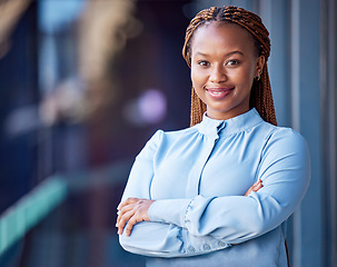 Image showing Confident, proud and satisfied business woman standing with arms crossed at office, ceo showing smile and leader working corporate on balcony at work. Portrait of black female boss expressing success