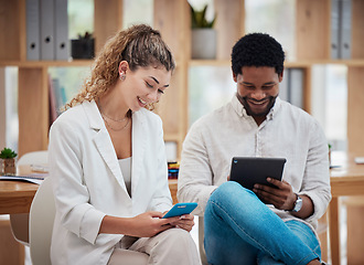 Image showing Technology, communication and networking with a business man and woman using a phone and tablet while sitting in their office at work. Connected, online and working together as a creative team