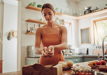 Image showing Healthy, organic and fresh food and vegetables ready for cooking with a young woman in a kitchen. Female nutritionist ready to make a nutrition, weight loss and health diet meal for dinner at home