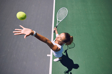 Image showing Fit tennis player, sport and serving during training, workout and exercise or match, game and competition from above. Sporty, active and healthy woman throwing a ball and practicing serve with racket