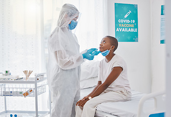 Image showing Corona virus nasal swab of covid patient in a hospital room with testing equipment. Medical worker, nurse or doctor taking nose or nasal sample for protocol, routine covid19 disease test in a clinic