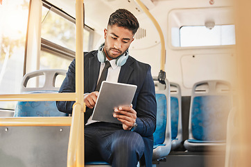 Image showing Business man, using tablet and bus for travel to work, home or working location. Relax businessman using headphones, public transport to cbd and mobile device to update social media or check schedule