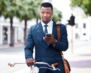 Image showing Phone, business and bike with a business man on his morning commute into work in the city. Businessman on the internet with 5g mobile technology on bicycle travel to decrease his carbon footprint