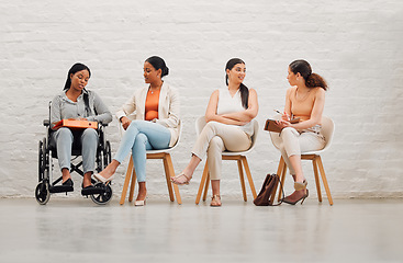 Image showing Inclusive group of women sharing idea and goals, planning and talking, sitting together at work. Diverse creative team chatting, brainstorming, discussing an idea for a startup or marketing strategy