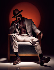 Image showing Suit, formal and fashionable model with class, style and fashion in studio showing abs and body muscle with shadow. Artistic man in trendy, elegant or cool clothing showing power against background