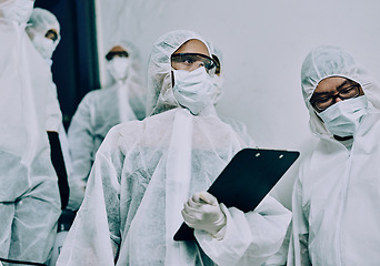 Image showing Doctors, healthcare workers and health team doing inspection, cleaning a building during covid pandemic and checking for danger. Employees wearing masks to protect from virus at a working site