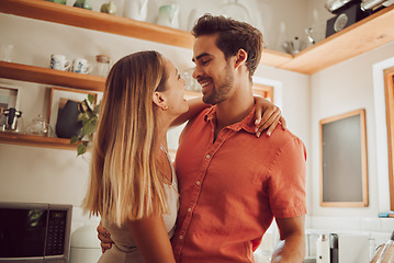 Image showing Romance, happy and love couple hugging, smile and bonding in kitchen. Romantic boyfriend and girlfriend embracing, enjoying their relationship and being carefree together.