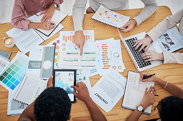 Image showing Meeting, planning and finance with a group or team of business people discussing data, a contract or financial report from above. Overhead of a boardroom meeting for strategy, growth and development