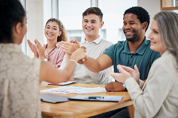 Image showing Creative team in meeting clapping and giving a handshake for a promotion and welcome. Diversity, professional and corporate group celebrating successful teamwork in corporate office boardroom.