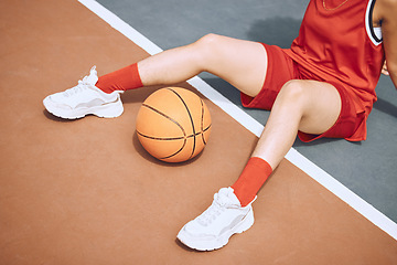 Image showing Fitness, sports and woman on basketball court floor for a break after playing a game alone in the summer. Fashion, cool and healthy athlete on the ground after training, wellness and cardio exercise