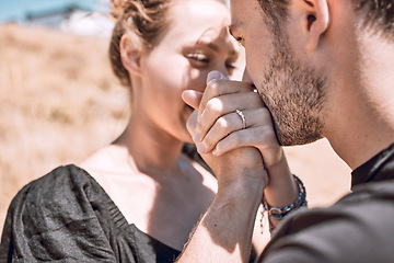 Image showing Engagement, love and romance with couple proposal and save the date goal. Closeup of man bonding, holding and kissing womans hands while feeling happy or excited with safety, security and trust ring