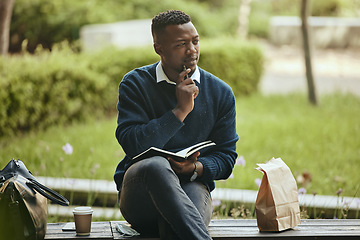 Image showing Business man writing in paper book, thinking of creative idea in city and eating lunch in park after work. Employee, worker and corporate person working on schedule and planning strategy with food