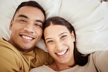 Image showing Happy, smiling and in love young couple enjoying spending time together at home in bed inside. Portrait of romantic and loving partners with a smile looking cheerful, positive and excited for the day