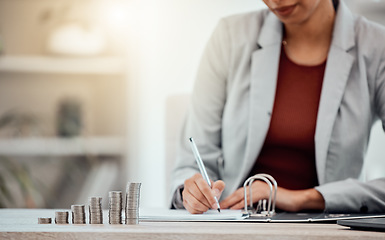 Image showing Writing in finance tax document for the financial book in a corporate office. Advisor or accountant doing paperwork and checking debt for work as well as profit that should be paid to their account