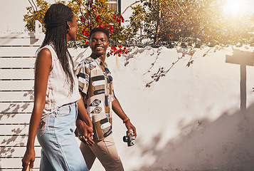 Image showing Young love couple walking in summer, sun and fresh outdoor air together in neighborhood with lens flare. Happy, smile and content black people holding hands to relax, support and enjoy quality time