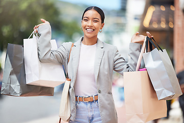 Image showing Woman shopping, fashion and retail gift bags for customer buying stylish clothes and spending money on a city spree. Portrait smile, happy and fun lady with cool, trendy and sales presents from store