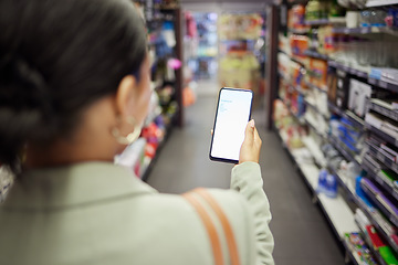 Image showing Woman shopping with phone screen at shop, reading grocery list on smartphone and looking for food items at a store. Back of a person buying meal products, household items on the weekend