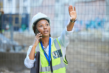 Image showing Construction worker, maintenance and development woman multitask on a phone while working. Building management employee on a work call helping holding up a hand on a contractor and builder job site