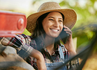 Image showing Agriculture, sustainability and farmer talking on phone call on a break while working on a farm. Happy sustainable farmland worker or agro woman having mobile conversation in the countryside