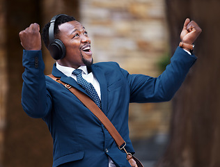 Image showing Businessman, happy and headphones of a worker or employee enjoying wireless connectivity in the outdoors. Excited, social and man listening to 5g connection to music in advertising mockup background.