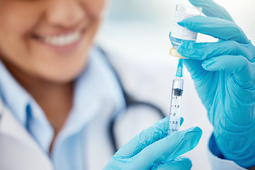 Image showing Doctor extracting medication from medicine vial with syringe in hospital or healthcare professional working at clinic. Vaccine treatment, or covid flu shot for sickness and medical nurse smiling.