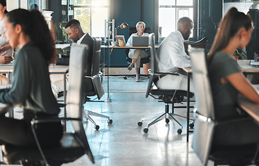 Image showing Corporate, modern office and diversity of business people working at their desk with the company CEO. Female leader working on her laptop. Busy staff working on projects in a professional workplace.