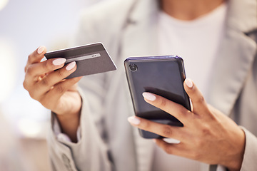 Image showing Ecommerce, fintech business woman with smartphone and credit card doing financial payment, online shopping or banking. Corporate finance hands using a secure and safe digital banking app or software